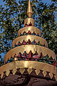 Vientiane, Laos - Wat Si Saket, a multi-tiered umbrella protecting a Buddha statue.
